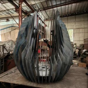 Large sculptural petal-shaped metal fire pit